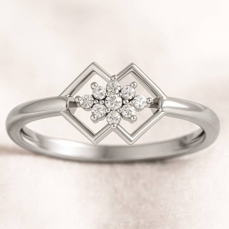 Gold ring with a diamond design on a light background