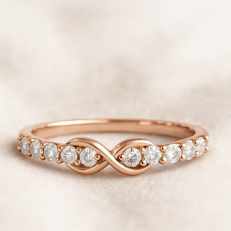 Rose gold ring with diamonds on a beige background
