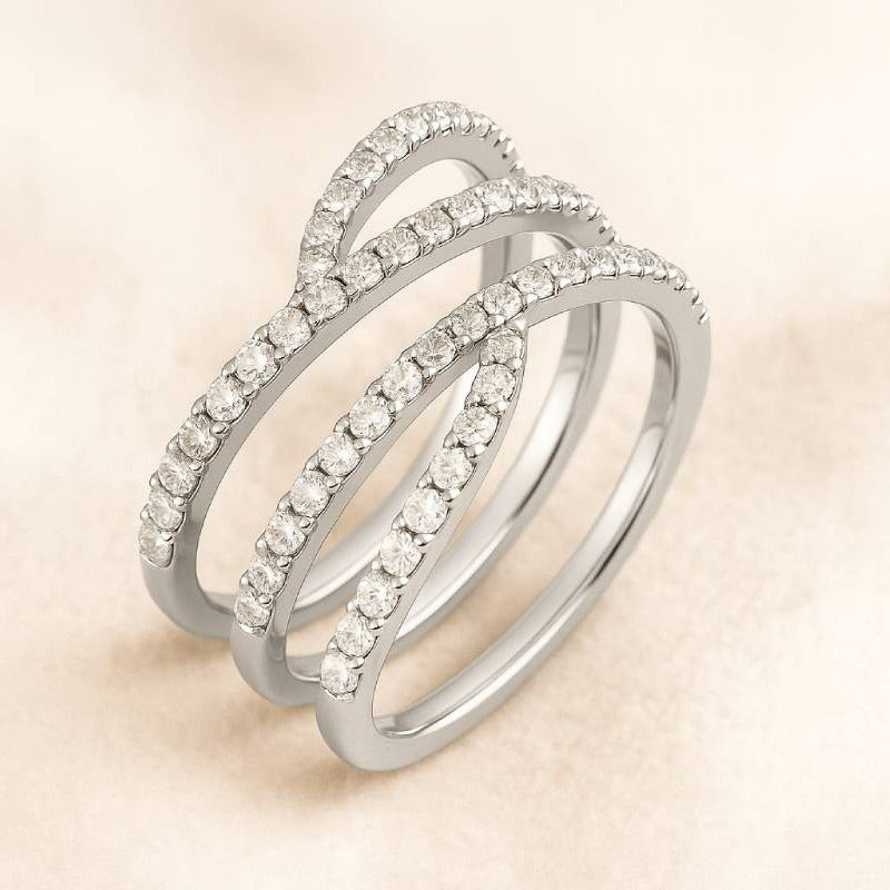 Gold ring with diamonds on a beige background