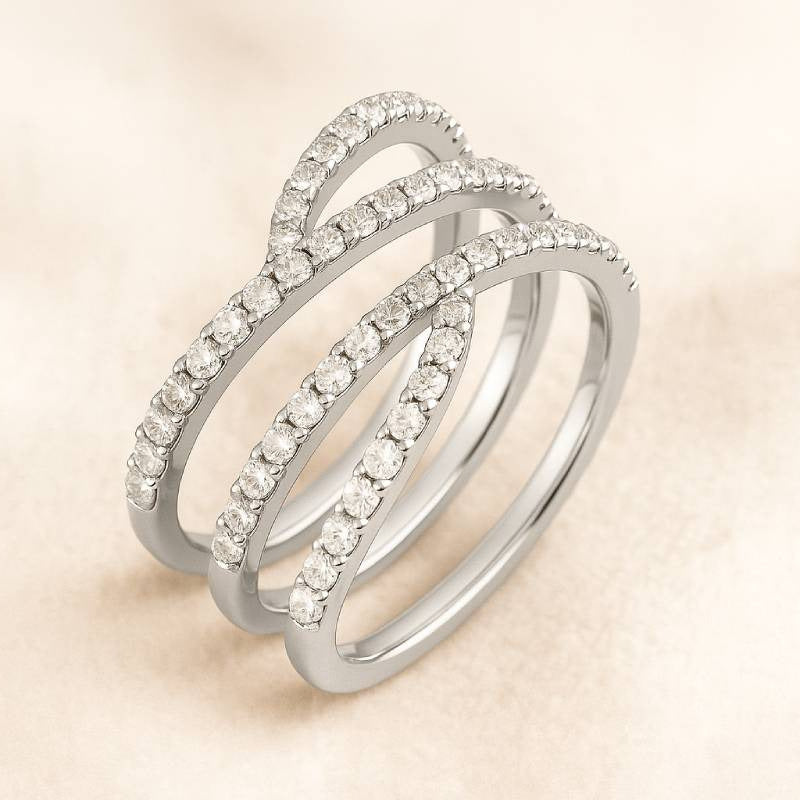 Gold ring with diamonds on a beige background