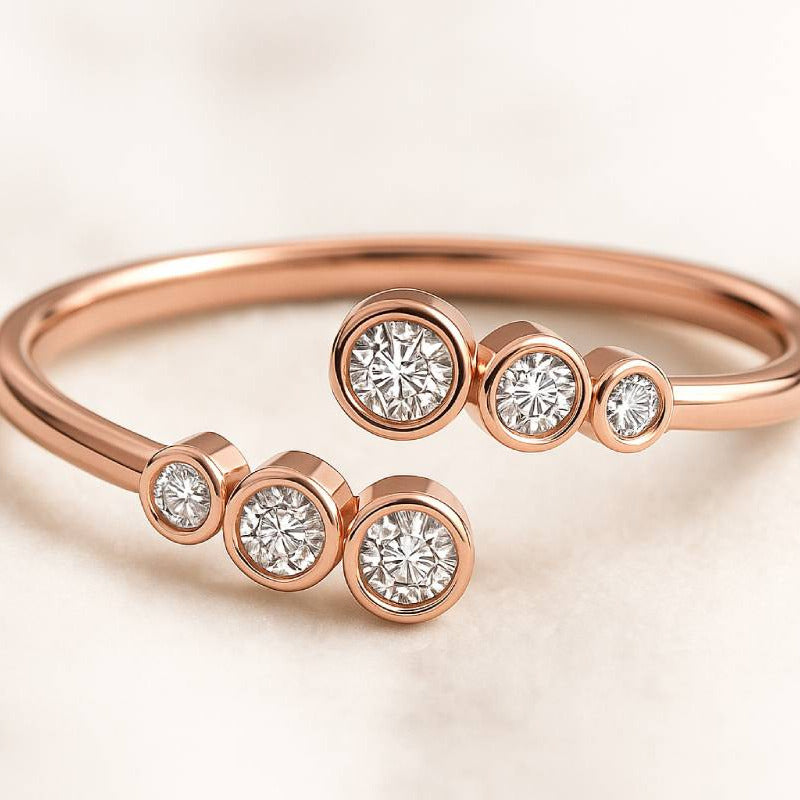 Rose gold ring with diamond accents on a light background