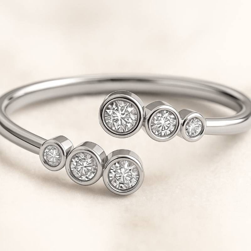 Gold ring with small diamonds on a light beige background