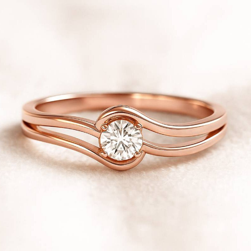 Rose gold ring with a diamond on a beige background