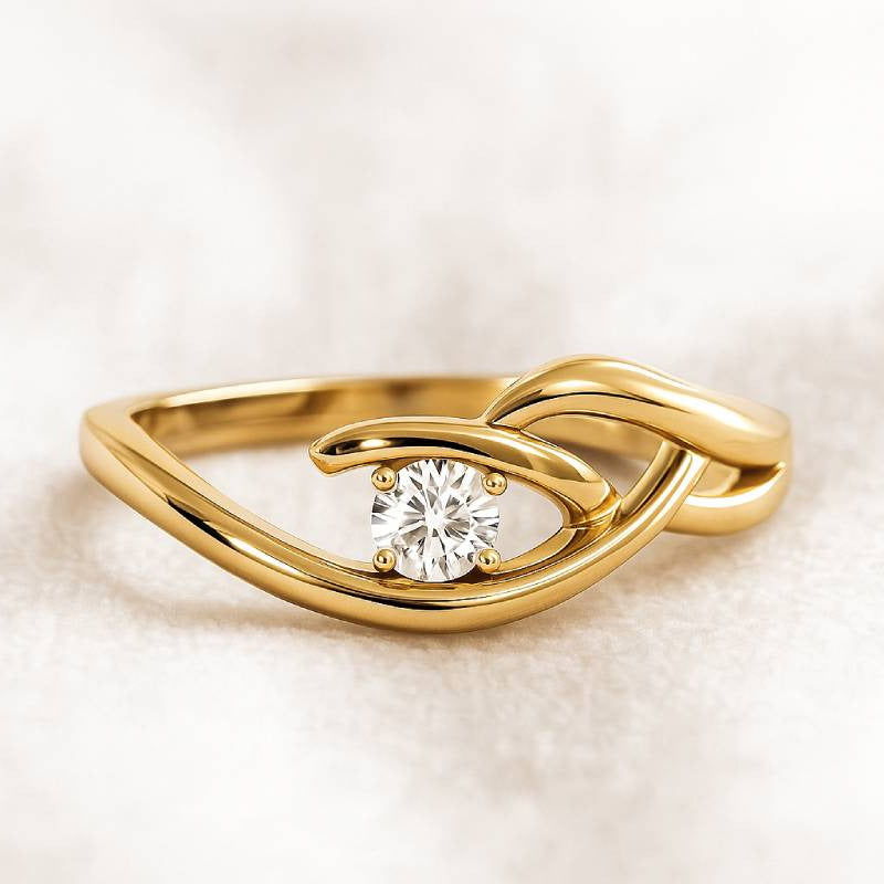 Gold ring with a diamond on a light beige background
