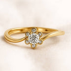 Gold ring with a diamond on a light beige background