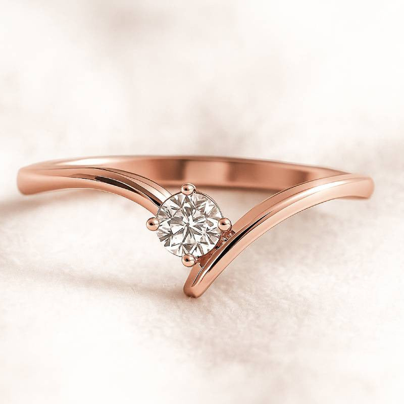 Rose gold ring with a diamond on a soft beige background
