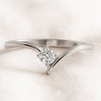 Diamond ring on a soft pink background