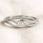 ring with a diamond on a light beige background