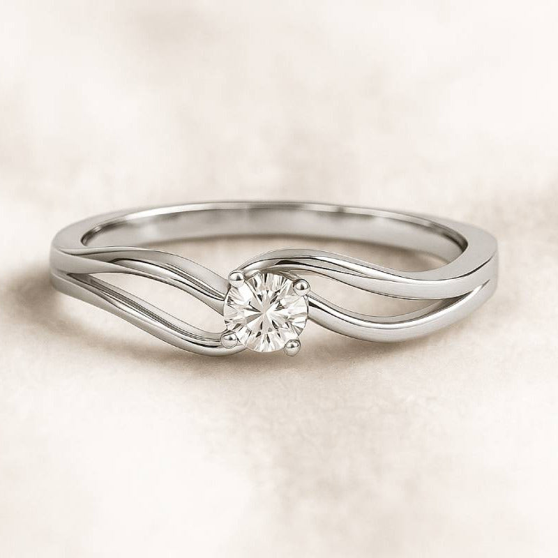 ring with a diamond on a light beige background