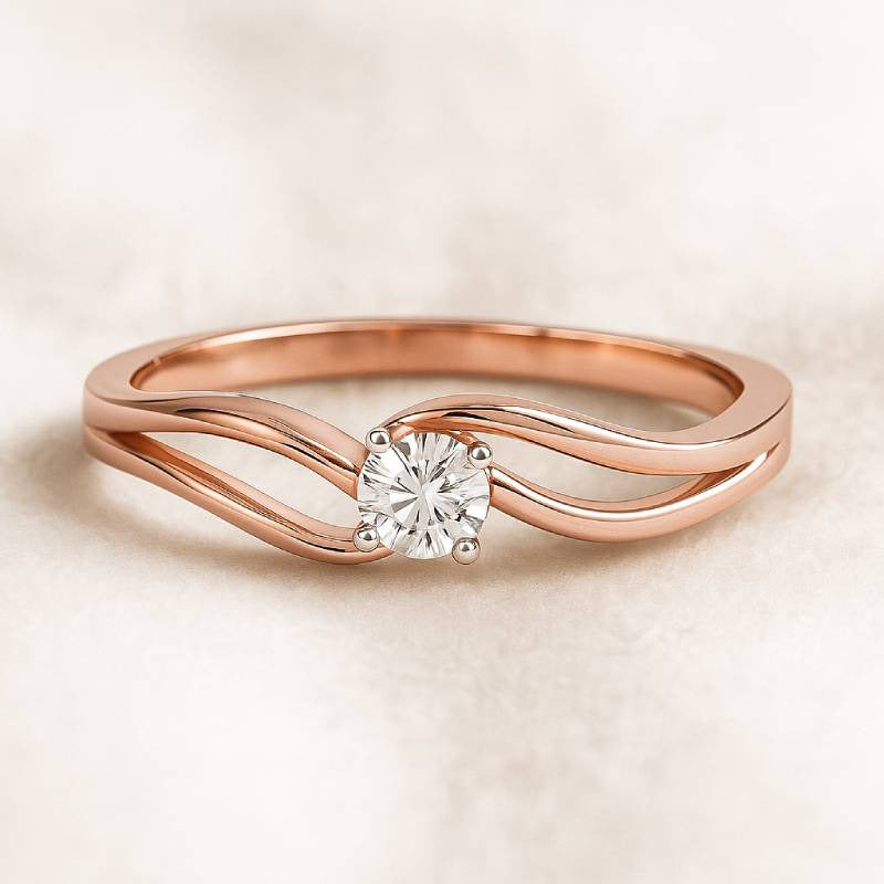Rose gold ring with a diamond on a beige background