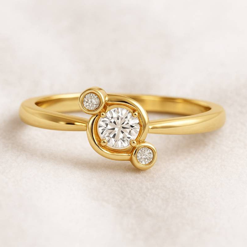 Gold ring with a diamond on a light beige background