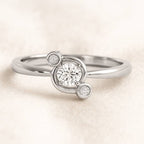 ring with a diamond on a light beige background