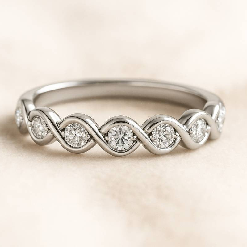 Gold ring with diamond accents on a beige background