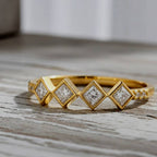 Gold ring with diamond on a Wood background