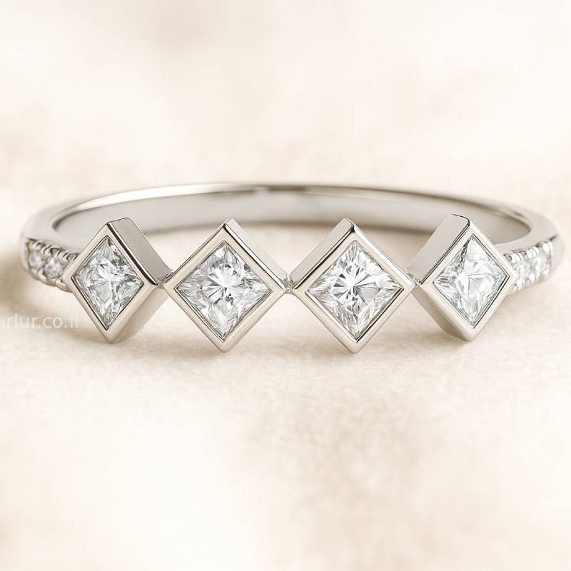  ring with diamond-shaped gemstones on a light background