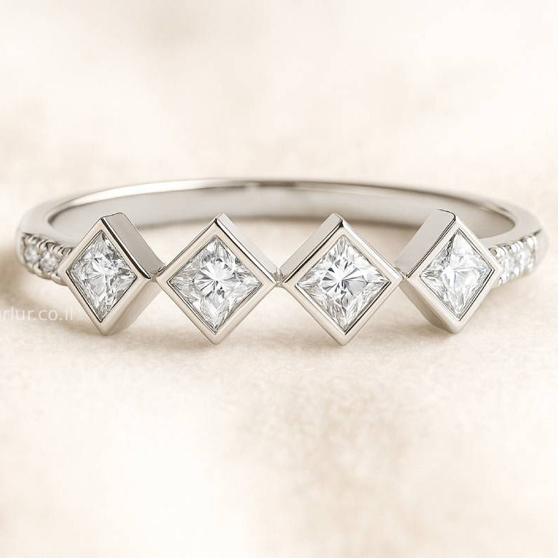 ring with diamond-shaped gemstones on a light background