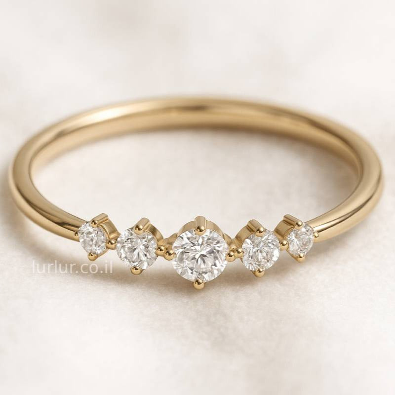 Gold ring with diamonds on a light background