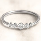 ring with small diamonds on a light background