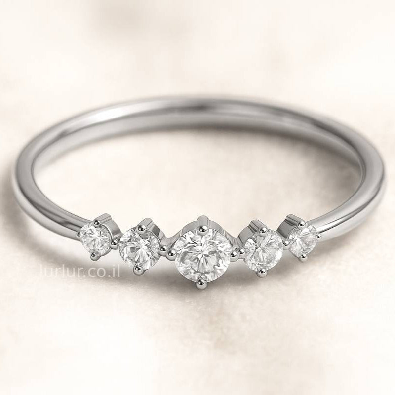 ring with small diamonds on a light background