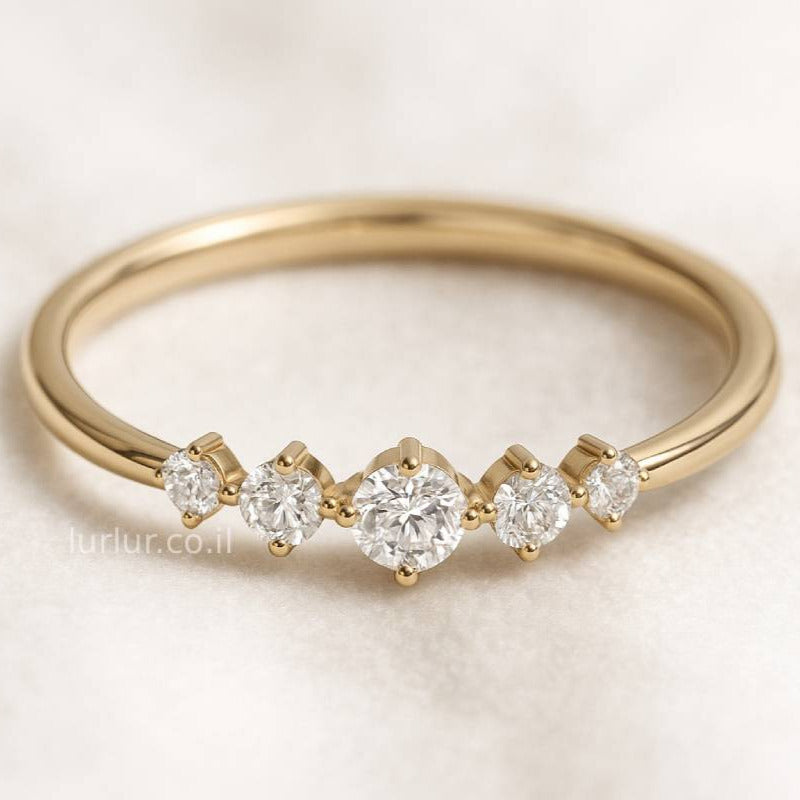 Gold ring with diamonds on a light background