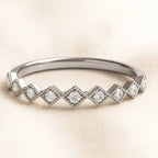 ring with diamond on a beige background