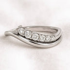 ring with diamonds on a light background