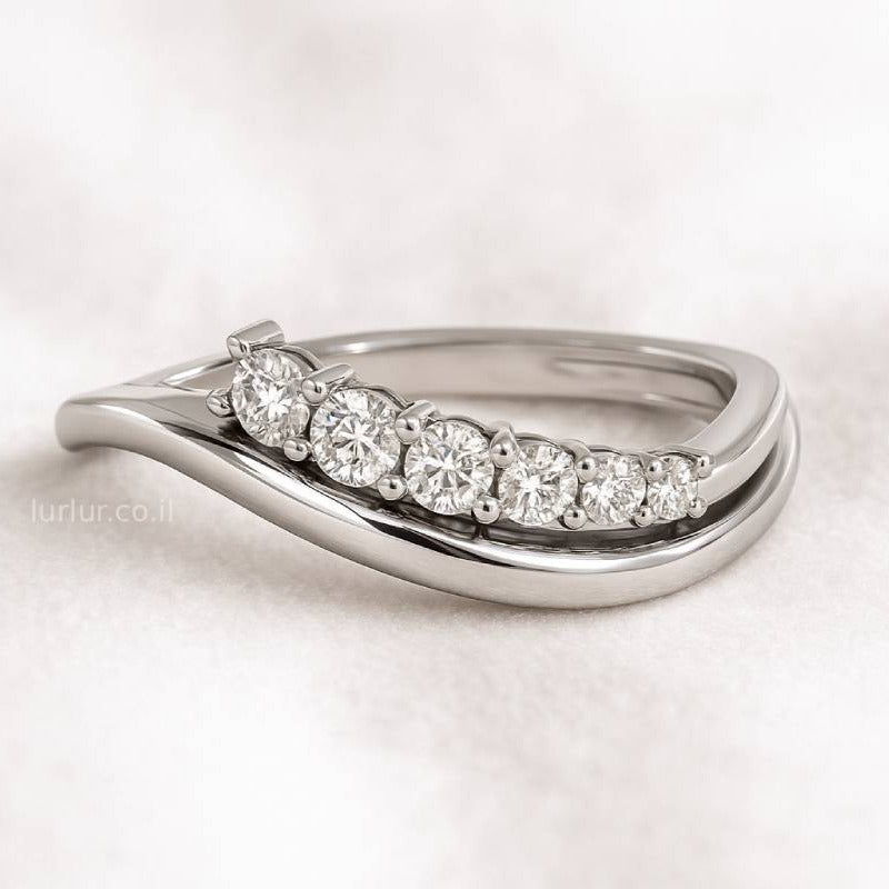 ring with diamonds on a light background