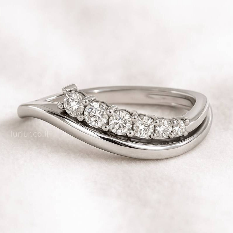 ring with diamonds on a light background
