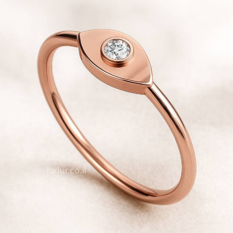 Rose gold ring with a diamond on a light beige background