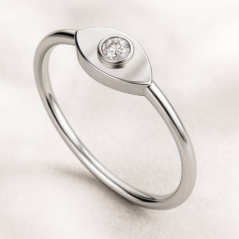 ring with a diamond on a light background