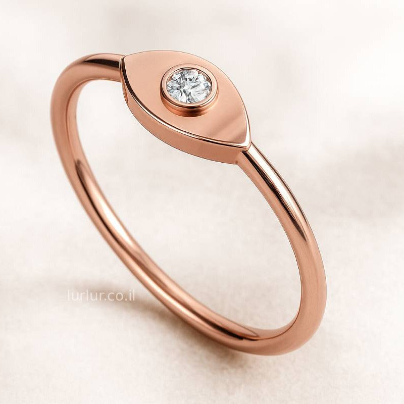 Rose gold ring with a diamond on a light beige background