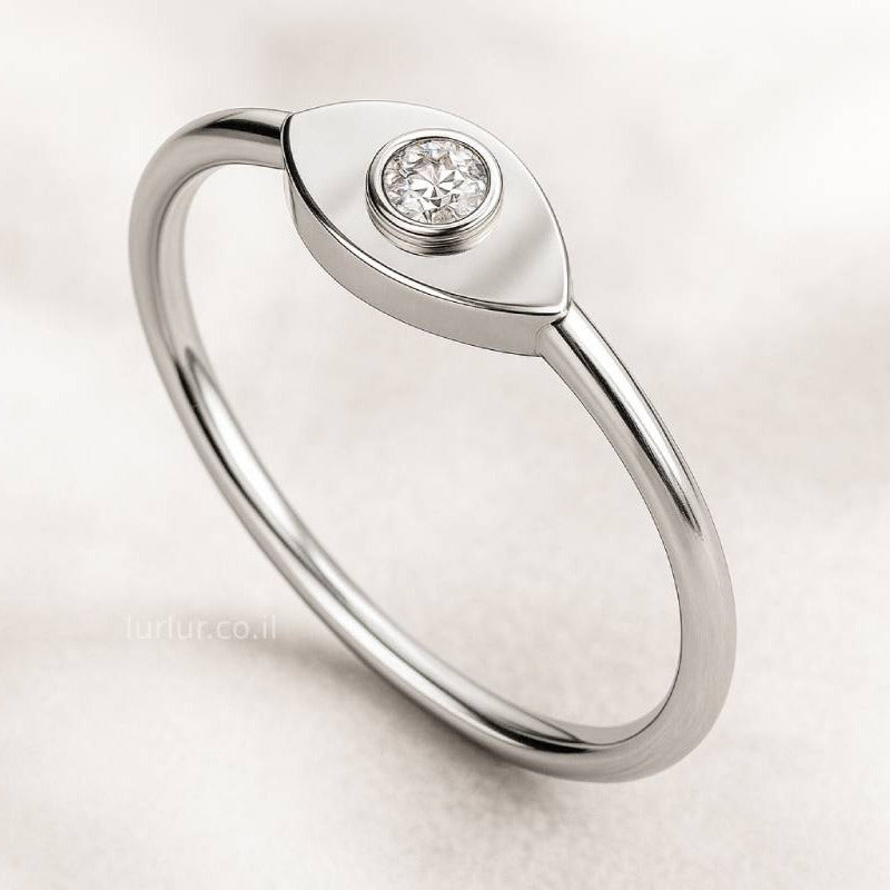  ring with a diamond on a light background