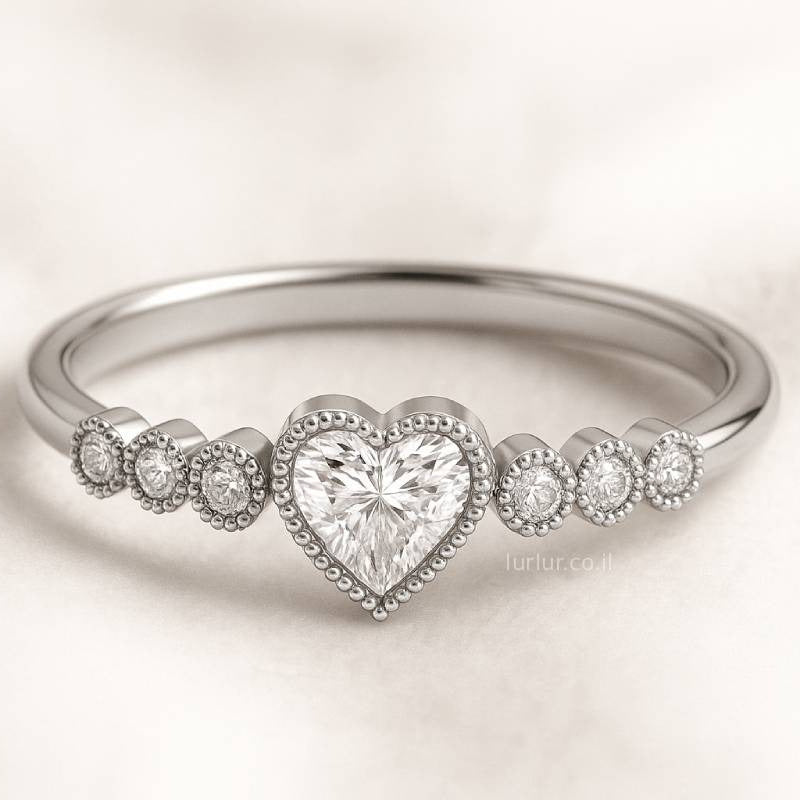 ring with a heart-shaped diamond on a light background