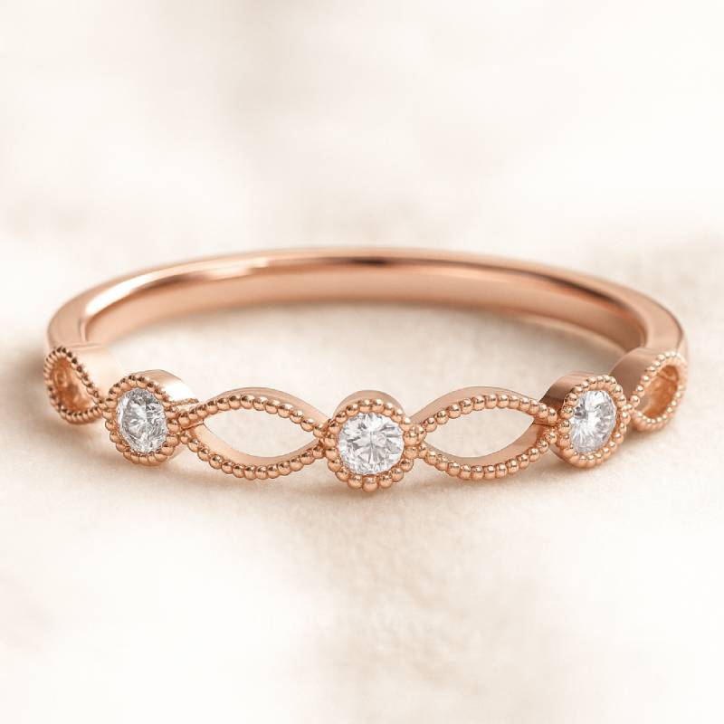 Rose gold ring with diamonds on a light background