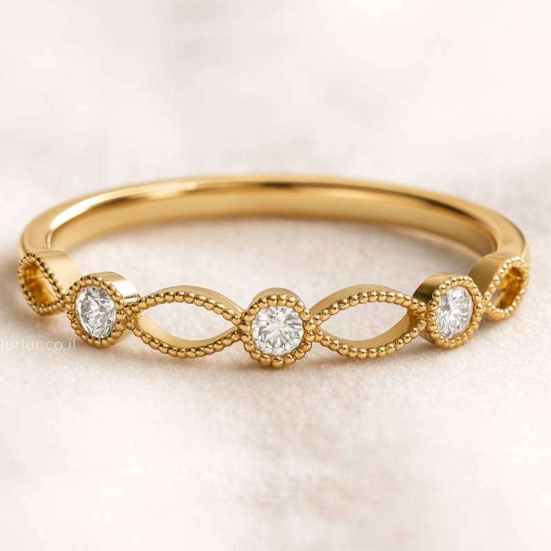 Gold ring with diamond accents on a light beige background