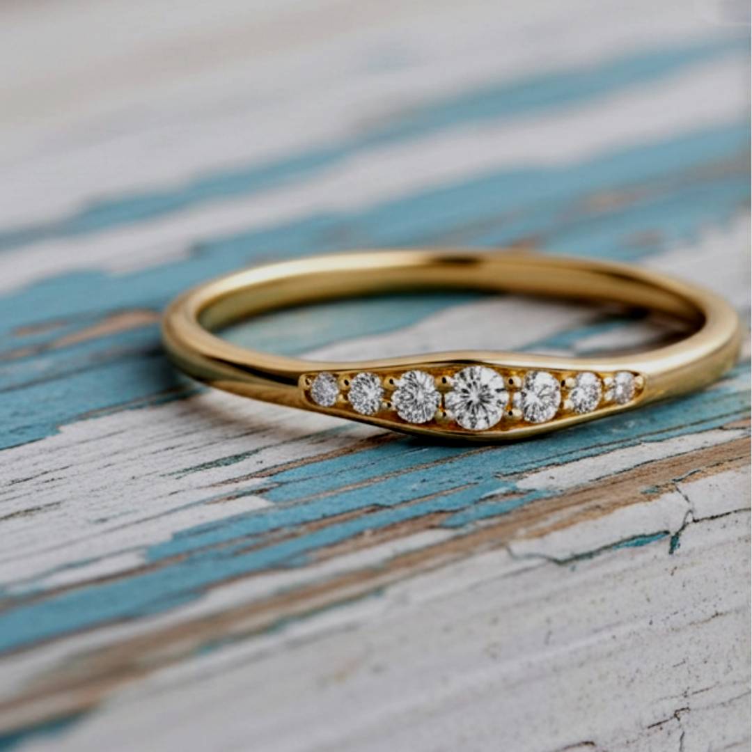 Gold ring with diamonds on a wood background