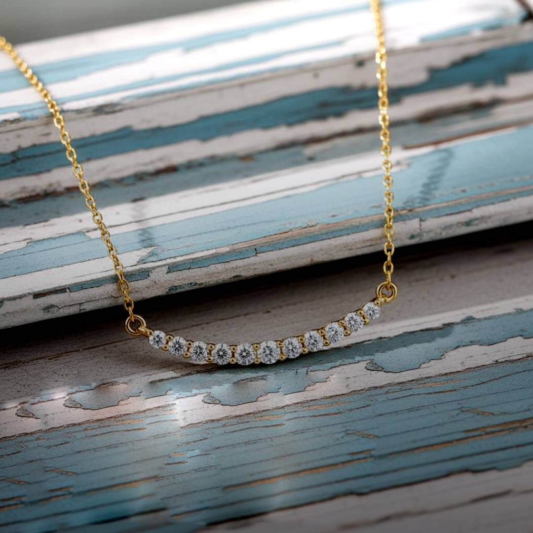 Gold necklace with diamonds on a wood background